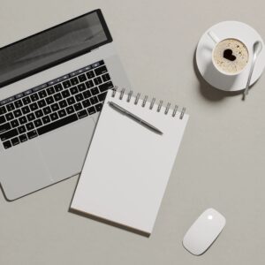 Minimal desk flat lay with notebook and pen for custom art commission deposit (product image)
